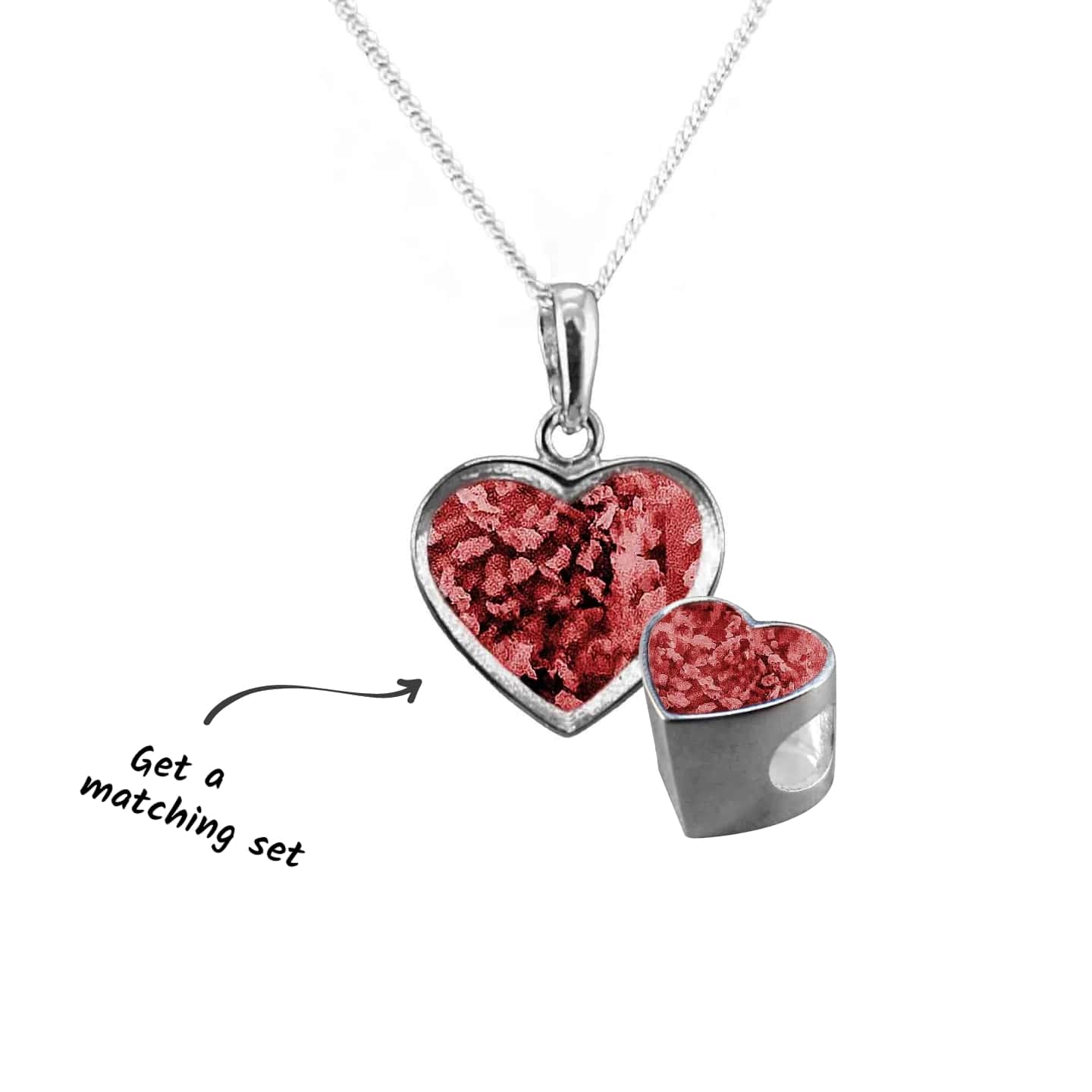 Heart-shaped silver pendant with red glittery interior on a white background